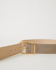 Details Our best-selling Milla belt reimagined in a new ultra smooth metallic leather. The Milla Geo Metallic fastens with our signature Italian-made Milla buckle in a polished gold finish. This classic leather belt is made from a lustrous metallic leather with a distressed look.  Details: Hip Belt Adjustment: 7 holes Strap Width: 1.5'' (3.81 cm) Buckle Height: 1.9'' (4.8 cm) Genuine Leather with Nubuck Lining Made in U.S.A. with Italian Hardware Sizing: X-Small: 31'' Small: 33'' Medium: 35'' Large: 37'' Measurement is taken from the buckle point to the center hole. Hip Belt, Divine Feminine, Classic Leather, Metallic Leather, Suspenders, New Shop, Waist Belt, Belt Bag, Gold Finish