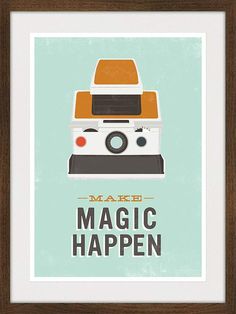 a pink poster with the words make magic happen next to an orange teapot on a table