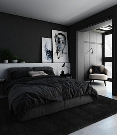 a black and white bedroom with a large bed