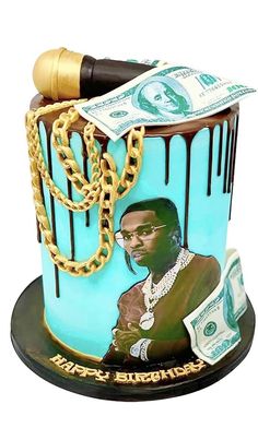 a blue cake with a gold chain and money on top