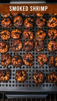 some food is cooking on a grill and the words smoked shrimp are in front of it