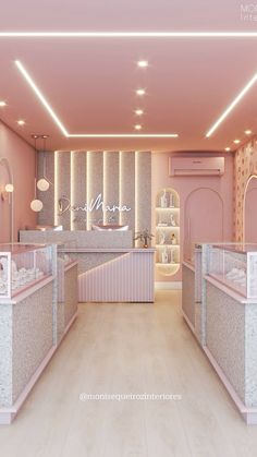 the interior of a store with pink walls and marble counter tops, along with lights