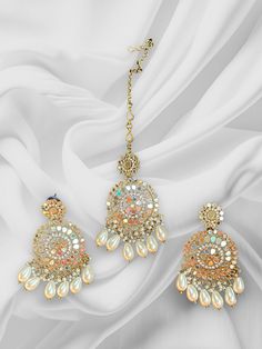 High Quality Silver and Pearl White finish with beaded work, this set is sure to be a perfect addition to any wardrobe! This mirror work tikka set is perfect for any bridesmaid, bride, sangeet or any occasion or event as a gift for any occasion as any one who loves jewelry will love this statement piece. It has beautiful colors that really make the set a statement piece. Product Details: • Maang tikka • Earrings Free Shipping/Ready to Ship and available immediately if you place an order today! F Multicolor Dori Work Jewelry For Celebration, Bridal Tikka, Pearl Mirror, Jewelry Kundan, Beaded Work, Maang Tikka, Authentic Indian, Mirror Work, Indian Jewelry