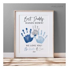 a framed print with the words best daddy hands down and two handprints on it