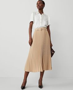 Keep it modern and easy with our belted pleated midi skirt, styled for a fully feminine spin. Belt loops. Self tie buckle belt. Hidden side zipper with hook-and-eye closure.,Hit:Hits at mid-calf,Imported:Imported,Length:34 1/4" long,Fabrication:100% Polyester,Garment Care:Machine Washable Belted Pleated Midi Skirt by Ann Taylor Size regular - 2 Baguette Women's Full, Skirts, 100%, Polyester, Machine, Washable Pleated Maxi Skirt Work, Pleated Cream Skirt, Long Cream Skirt, Pleated Skirt Outfit Casual, Work Outfits Women Skirt, Professional Skirts, Long Pleated Skirt Outfit, Professional Fits, Fun Skirts