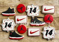 decorated cookies in the shape of basketball shoes and numbers on wooden table with wood background