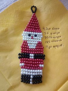 a christmas ornament made out of beads