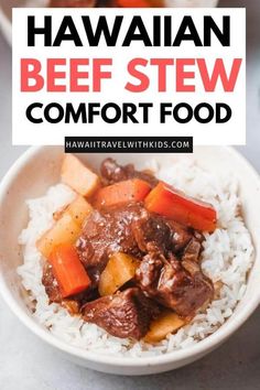 a bowl full of beef stew with rice and carrots in it, on top of a table