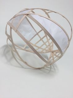 a white and beige object with lines on it