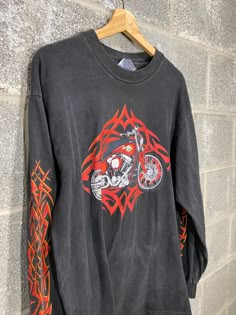 B Blaze Vintage offers this Vintage Y2K 2000 Custom Custom Chrome Bikes Harley Motorcycle Graphic Long Sleeve Shirt Hanes Tag, Size L. Measurements upon request. All flaws will be pictured, see photos for condition. Please reach out for any questions! Follow us on Instagram! @BBlazeVintage Refund Policy No refunds will be granted due to dissatisfaction of how the items looks or fits. If there was a flaw in the item you feel that was missed, please reach out to us ASAP to find a solution. If you Red Long Sleeve T-shirt Y2k Style, Red Long Sleeve Y2k T-shirt, Red Y2k Long Sleeve Tops, Red Long Sleeve Y2k Top, Biker Streetwear Tops For Fall, Fall Streetwear Biker Tops, 90s Long Sleeve Tops For Streetwear, Biker Style Tops For Fall Streetwear, Biker Style Tops For Streetwear In Fall