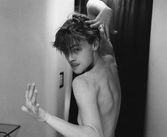 black and white photograph of a woman brushing her hair