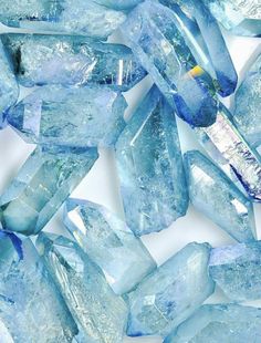 some blue ice cubes on a white surface