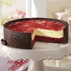 a chocolate cake with red and white frosting