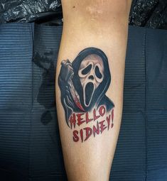 a person with a tattoo on their leg that says hello spidery and a ghost holding a knife