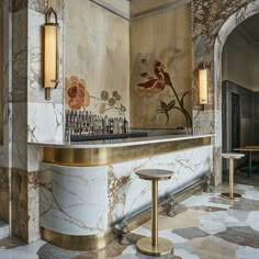 an elegant bar with marble walls and flooring