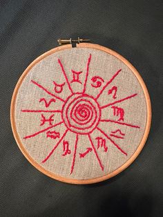 a red embroidery on a black background