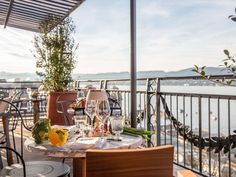 an outdoor dining area overlooking the water