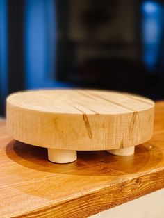 a wooden object sitting on top of a table