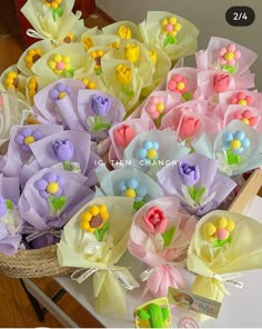 a basket filled with lots of colorful flowers