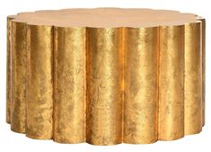 a gold colored table with four columns on it