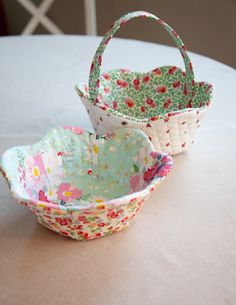 two baskets sitting on top of a table