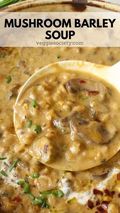 mushroom barley soup in a white bowl with a wooden spoon