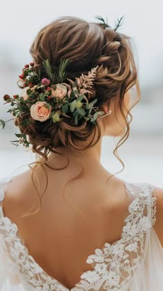 a woman with flowers in her hair is wearing a wedding dress and looking off into the distance