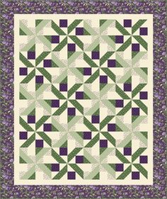 a quilt with green and purple squares on it