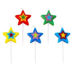 four star shaped lollipops sitting on top of each other in different colors