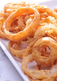 some onion rings on a white plate