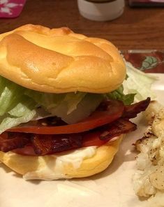 a bacon, lettuce and tomato sandwich on a plate