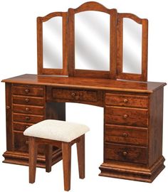 a wooden desk with mirror and stool next to it