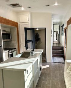 the kitchen is clean and ready to be used as a living room or dining area