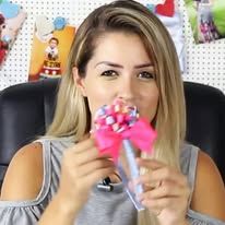 a woman sitting in a chair eating a candy cane