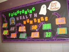 a bulletin board with writing and numbers for children's health care centers on the wall