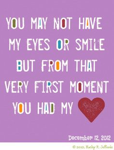 a blue sign with an orange heart on it that says, you may not have my eyes or smile but from that very first moment you had my heart