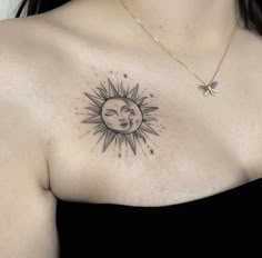 a woman with a sun and moon tattoo on her chest