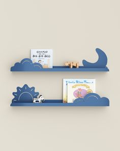 two blue shelves with books on them against a gray wall, one has a book shelf and the other is a cloud