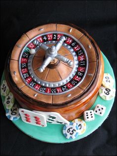 a cake that is shaped like a rouleet with dices and numbers on it