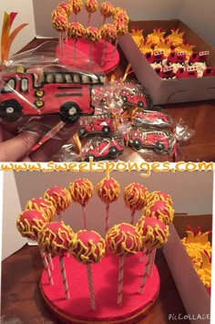 the cake is shaped like a firetruck and has lollipops in it