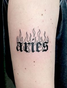 a tattoo with the word fire on it