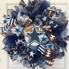 a wreath made out of mesh and footballs