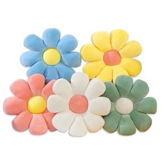 four different colored flower shaped hair clips