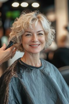 Click for More ➡️ | Save for Later ❤️  A trendy bob with an undercut on one side, paired with asymmetrical fringe that adds an edgy twist. The blonde color enhances the modern feel of the cut. (Blonde Curly Bob with Undercut and Asymmetrical Fringe - Curly Bob Hairstyles For Over 50) Curly Bob With Fringe Fine Hair, Wavy Bob With Bangs Fine Hair, Chin Length Curly Bob Hairstyles, Wavy Shaggy Bob, Short Bob With Curls, Curly Bob With Undercut, Curly Layered Hairstyles, Stacked Curly Bob Haircut, Short Curly Bob With Bangs