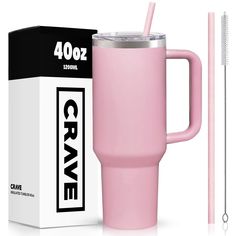 a pink travel mug with a straw in it next to a box and a toothbrush