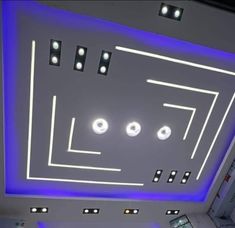 an overhead view of a ceiling with blue lights