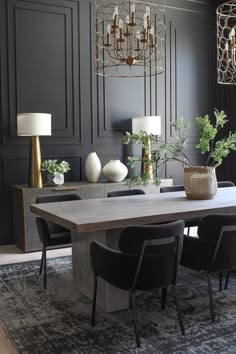 a dining room table with chairs and a chandelier