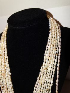 "89 grams weight, Vintage 5 Strands of 46\" lenght each, Rice Pearl Necklace. Excellent condition." Luxury Traditional Pearl Necklace With Cutdana, Luxury Traditional Pearl Necklace, Luxury Traditional Women's Pearl Necklace, Luxury Traditional Necklace With Pearl Drop, Luxury Meenakari Pearl Necklace In Temple Jewelry Style, Luxury Traditional Pearl Necklace For Women, Pearl Jewelry Necklace Indian Totaram Jewelers, Luxury Traditional Pearl Necklace With Pearl Chain, Traditional Luxury Pearl Necklace For Women