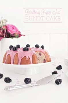 a bundt cake with blackberries on top