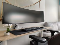 a computer monitor sitting on top of a wooden desk